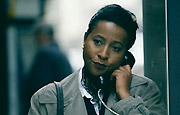 Photo: worried woman on payphone